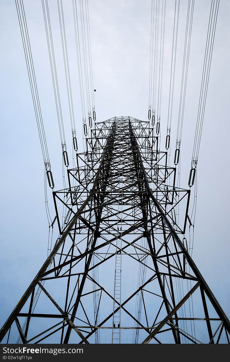 Electric high voltage post with sky background