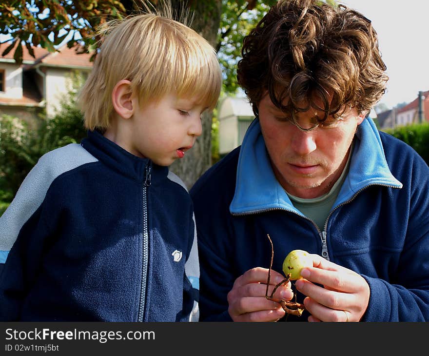 Father teaches son to know nature. Father teaches son to know nature