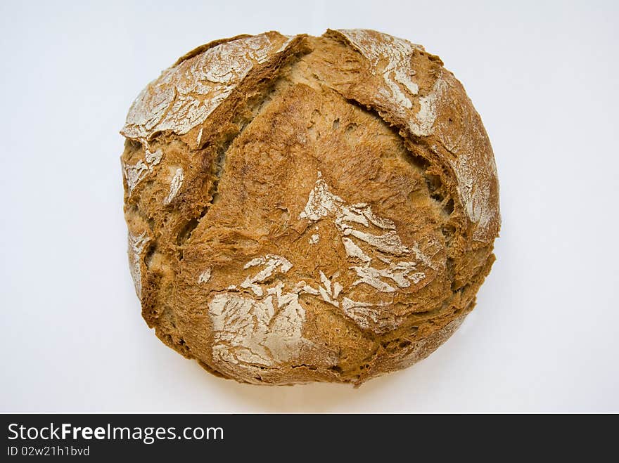 Rounded crunchy bread isolated on white.