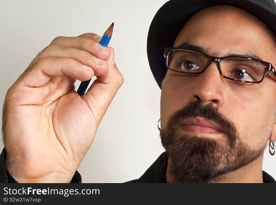 Man with glasses and a hat with a pencil in white background