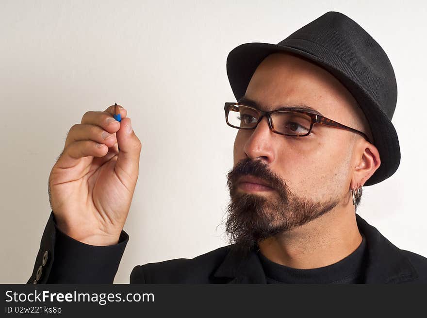 Man with glasses and a hat with a pencil in white background