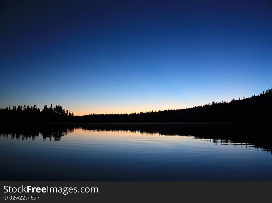 Before dawn, first light hits the lake. Before dawn, first light hits the lake