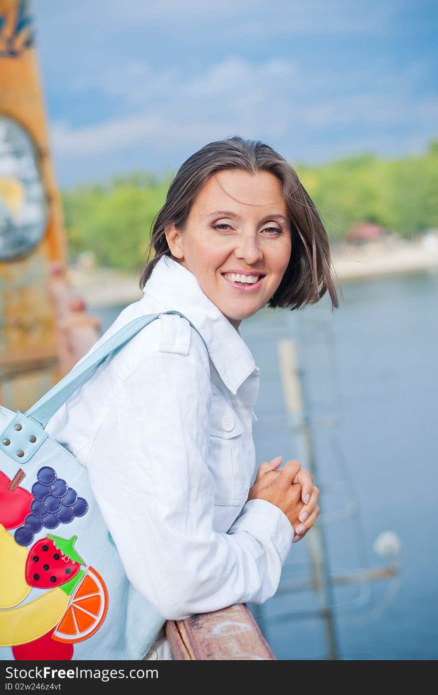 Portrait of a young beautiful woman on autumn walk