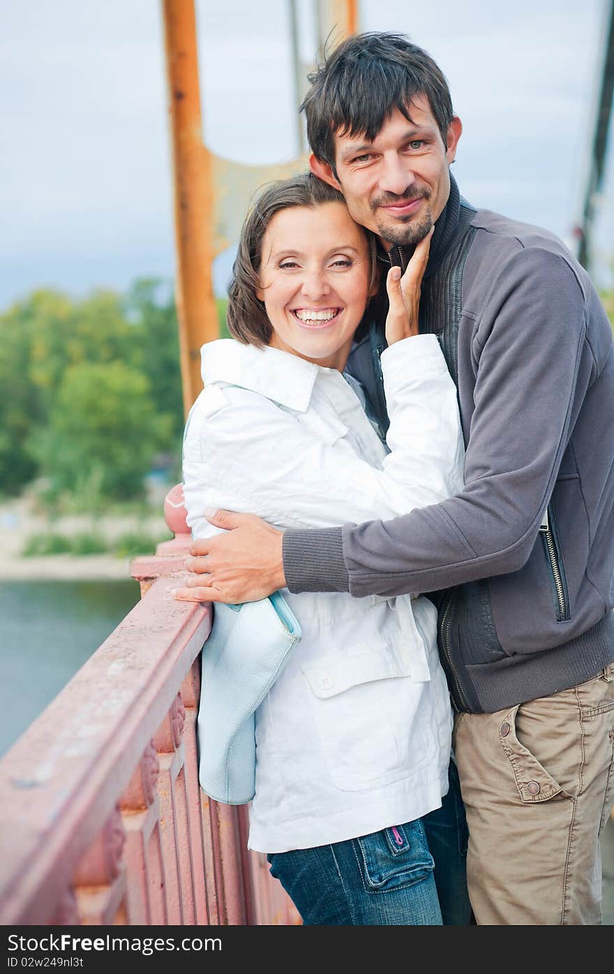 Young beautiful couple having fun in the autumn walk