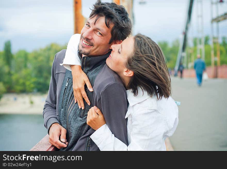 Young beautiful couple having fun in the autumn walk