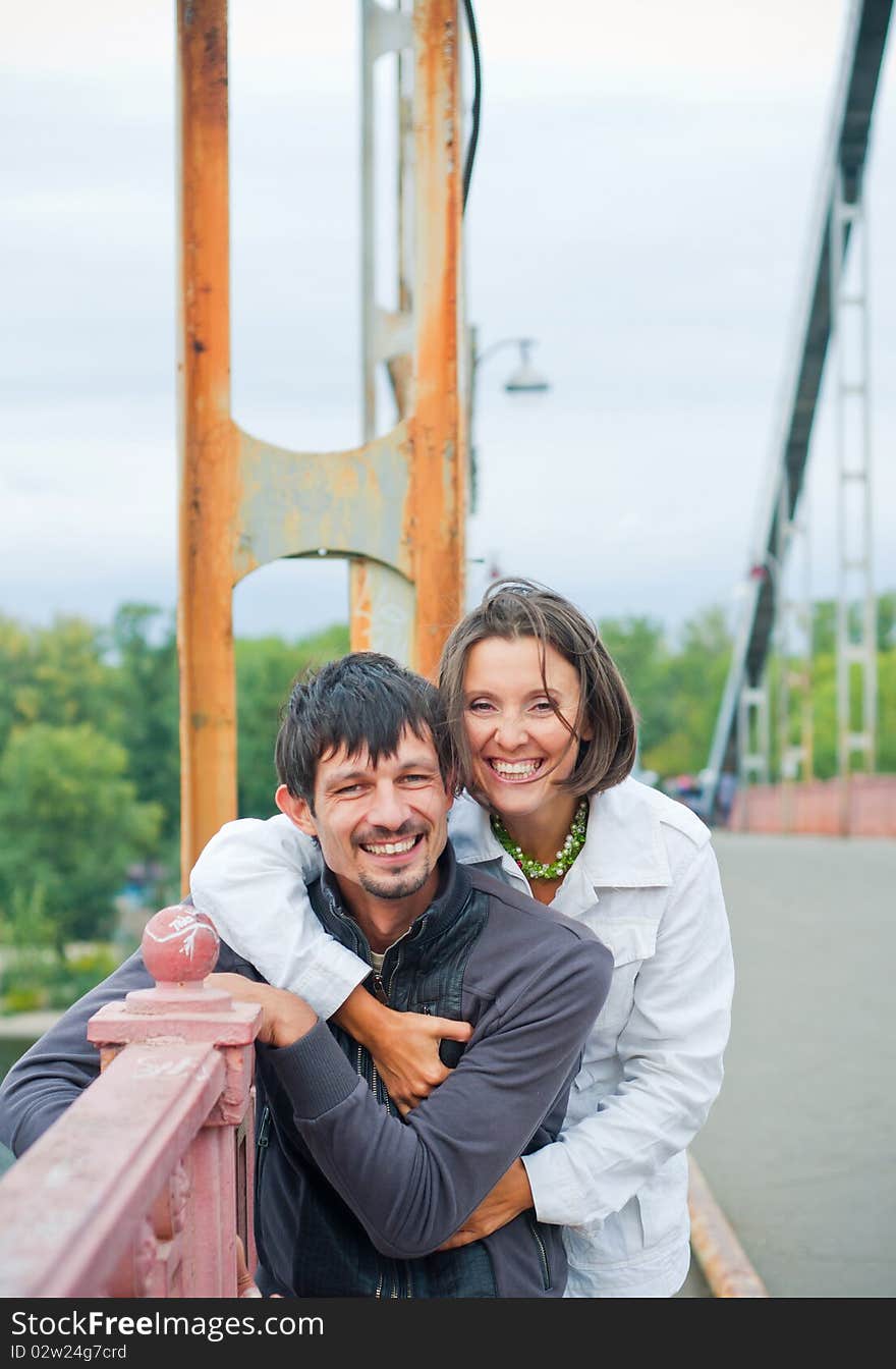 Young beautiful couple having fun in the autumn walk