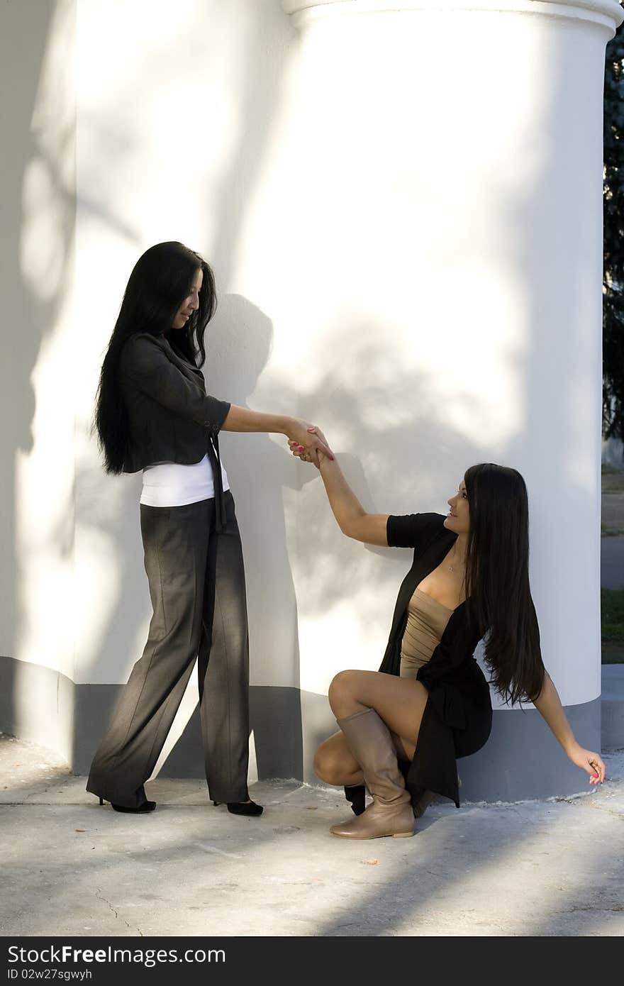 Two female friends walking outdoor