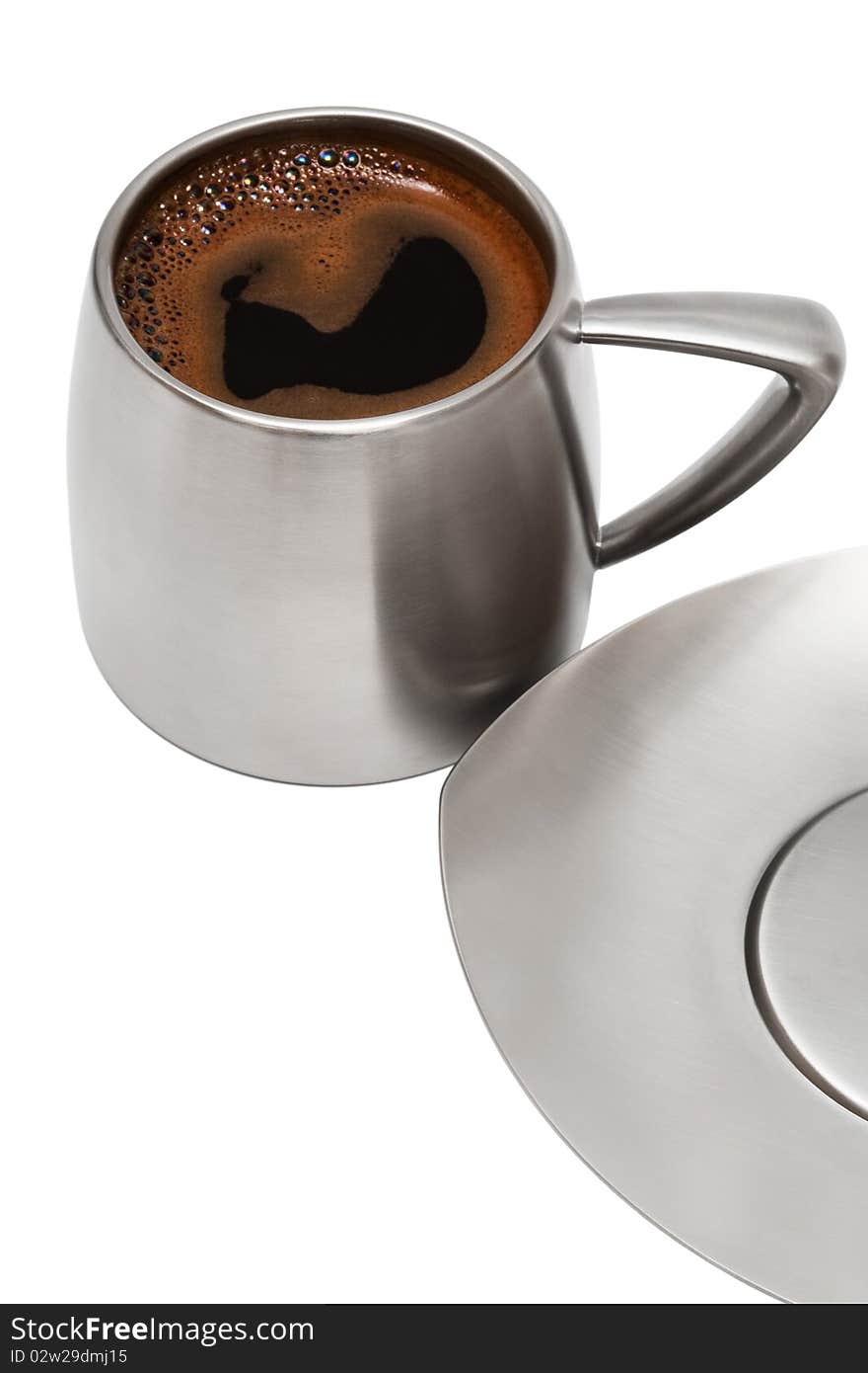 Coffee in a metal mug on a white background