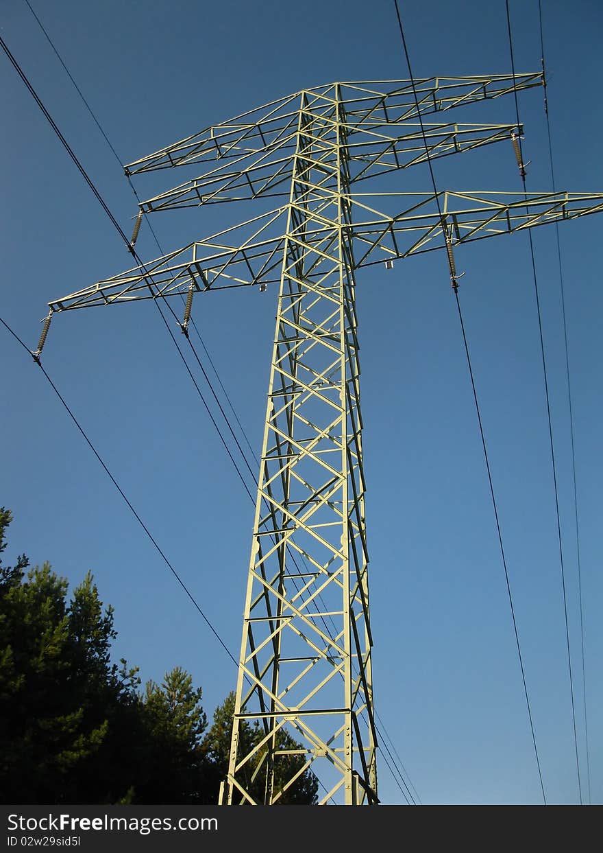 Pillar of the old high-voltage lines in the blue sky