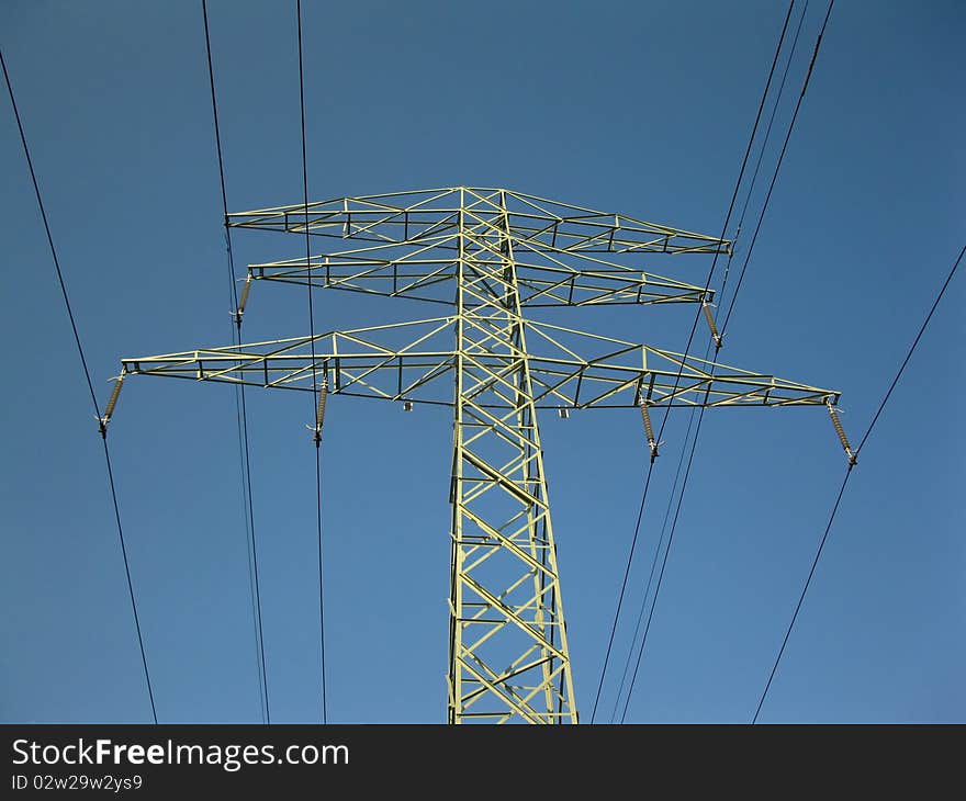 Pillar of the old high-voltage lines in the blue sky