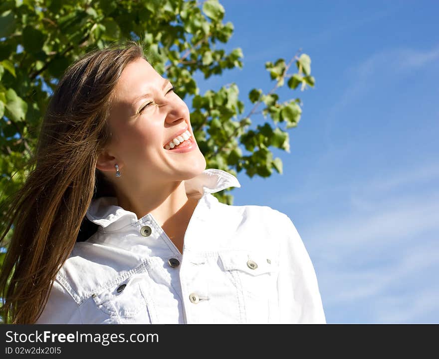 Beautiful young brunette laughs positive. Beautiful young brunette laughs positive