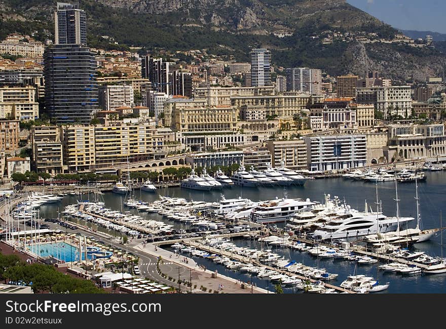 Landscape view of Monaco and yachts in the marina. Landscape view of Monaco and yachts in the marina.