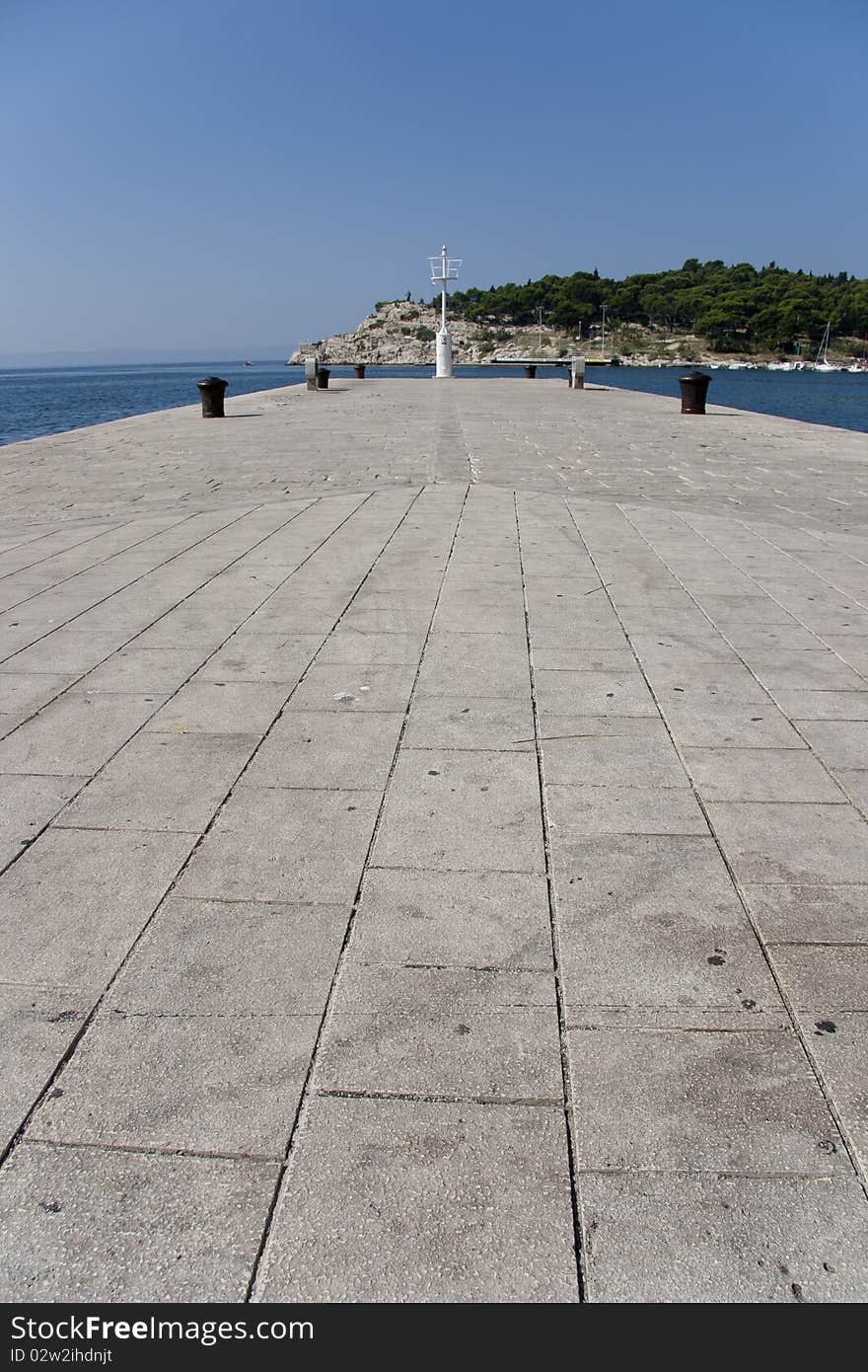 Concrete pier with warning light stand at the end