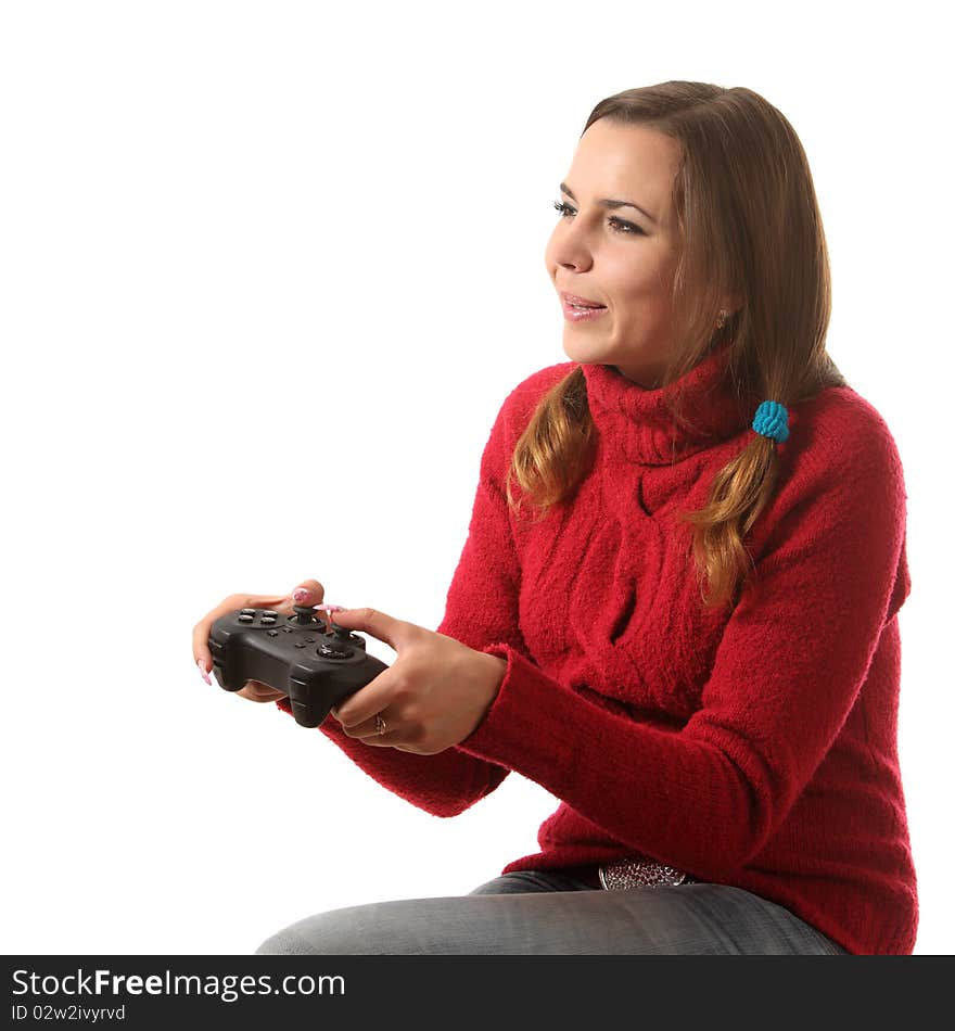 Girl play computer game with helping of a gamepad. Girl play computer game with helping of a gamepad