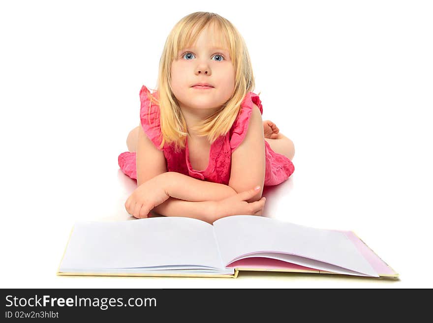 Happy little girl reading a book