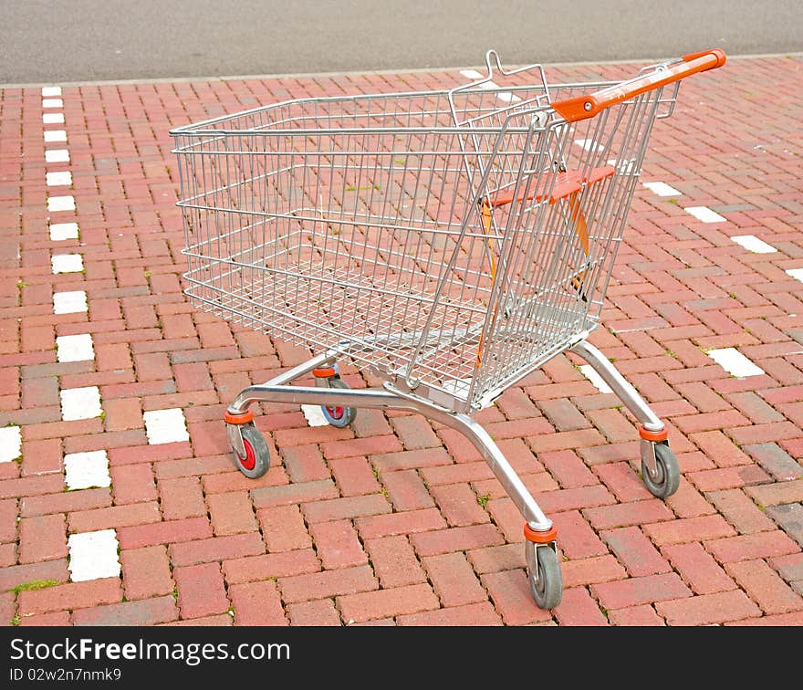 Shopping Trolley In Parking Bay.