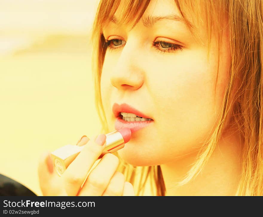 Beautiful young woman with lipstick