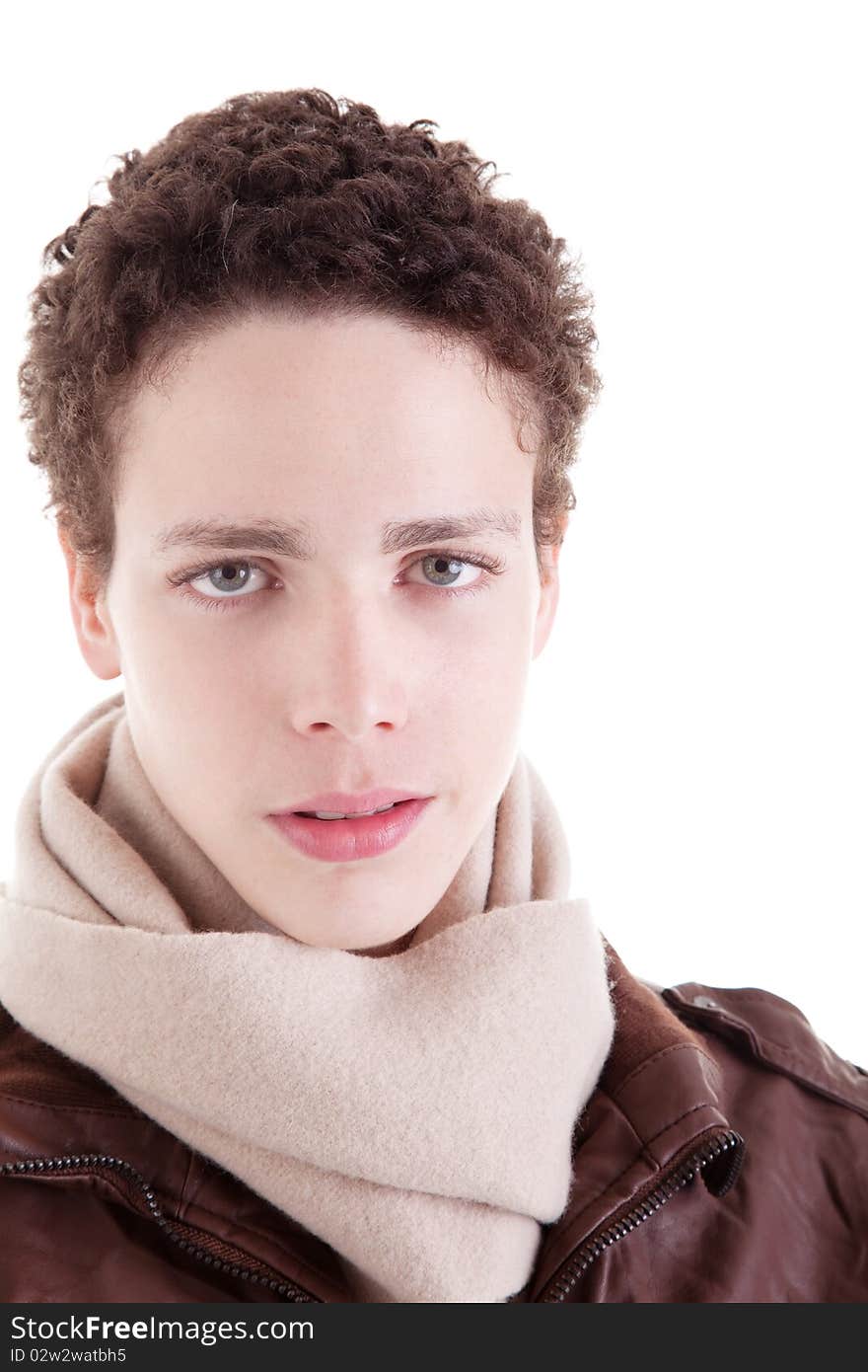 Portrait of a serious young man, with winter clothes, on white background. Studio shot