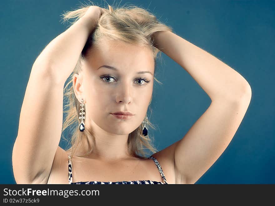 Beautiful model on a blue background. Beautiful model on a blue background