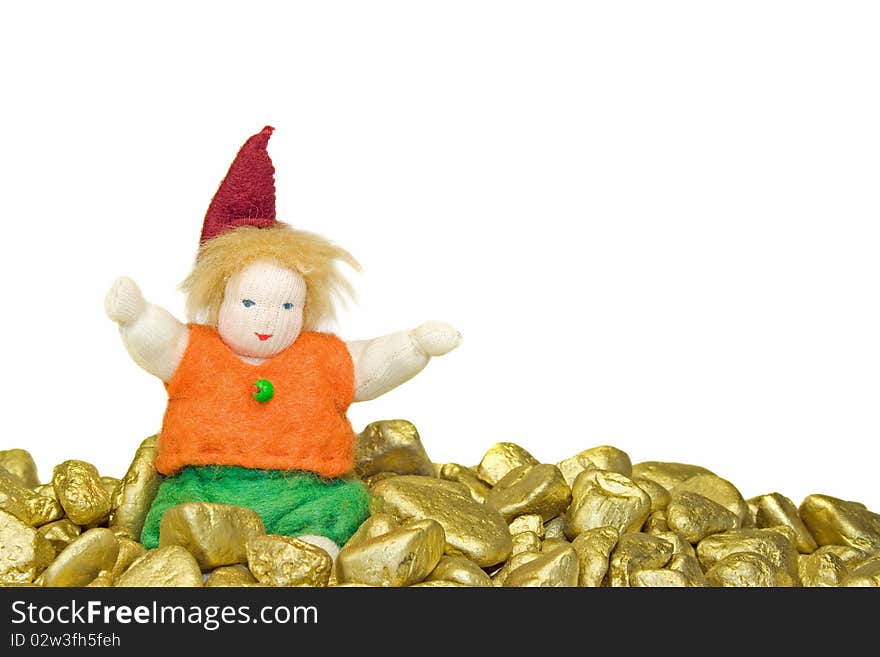 Doll sitting on gold nuggets. Doll sitting on gold nuggets