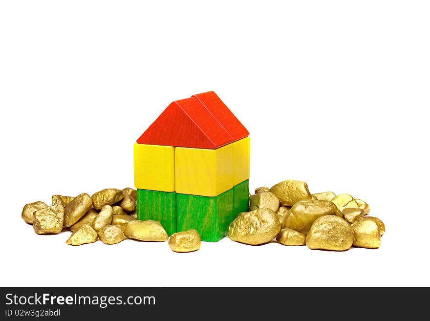 Toy house with gold nuggets. Toy house with gold nuggets