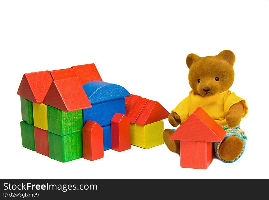 Teddy bear is dreaming of a own house. Teddy bear is dreaming of a own house