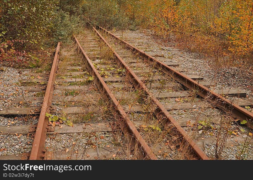 Railroad tracks at an abandoned factory. Railroad tracks at an abandoned factory