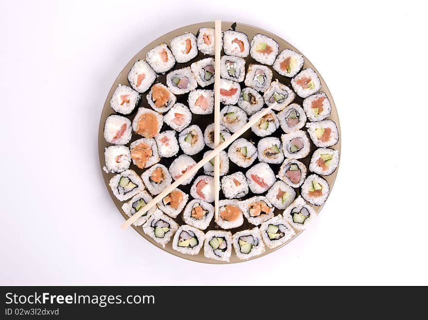 Collection of different rolls served on the round plate. Collection of different rolls served on the round plate