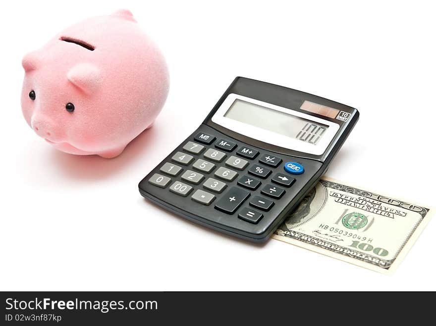 Calculator, piggy bank and 100 dollars. Isolated on white background. Calculator, piggy bank and 100 dollars. Isolated on white background