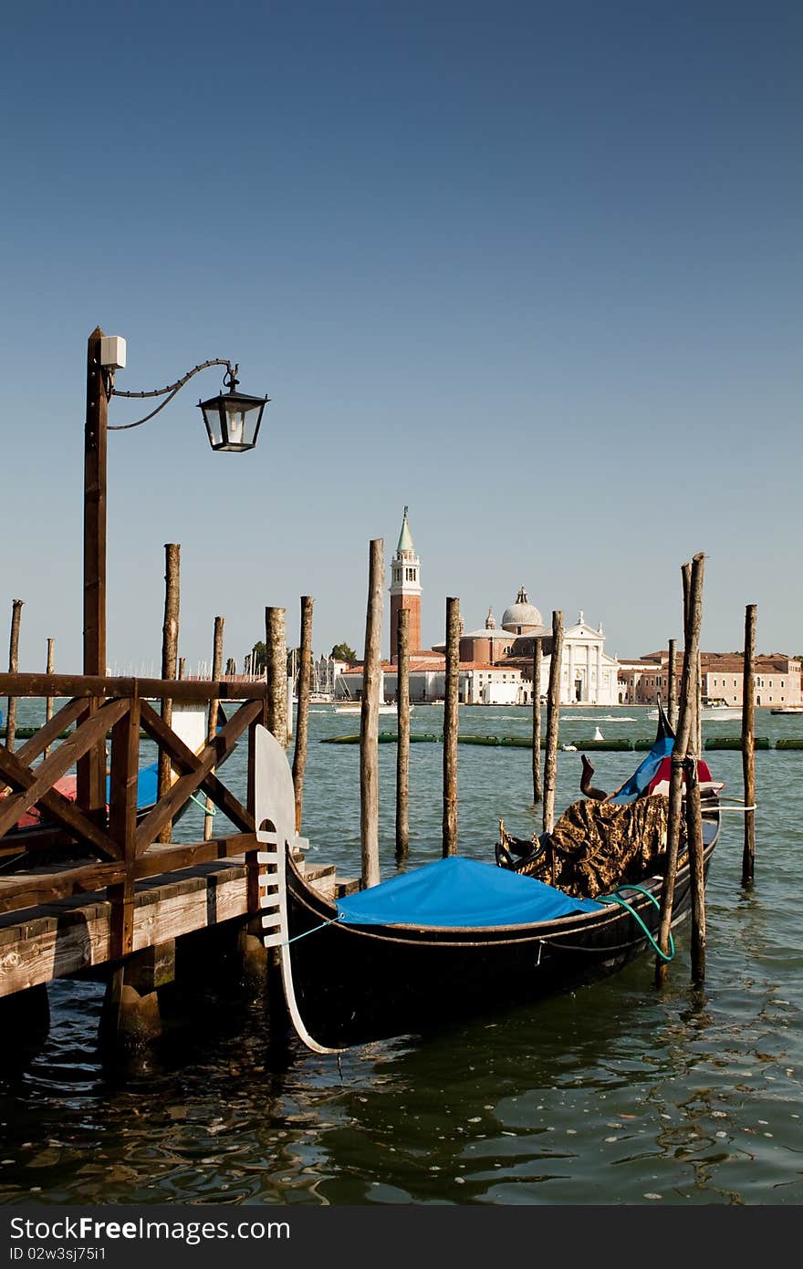 A Venetian Boat By A Landing Stage