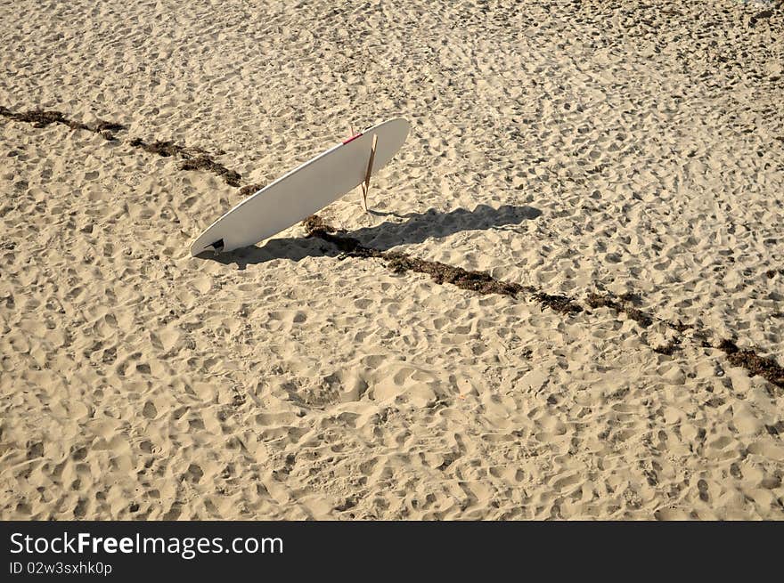 Lonely Surfboard on the Beach