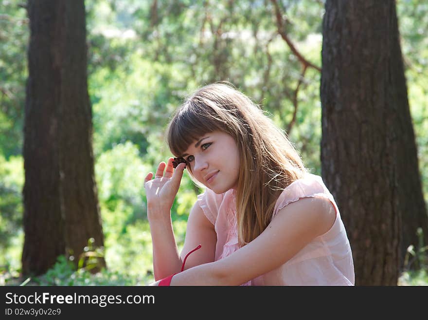 Girl in the forest at sunny day