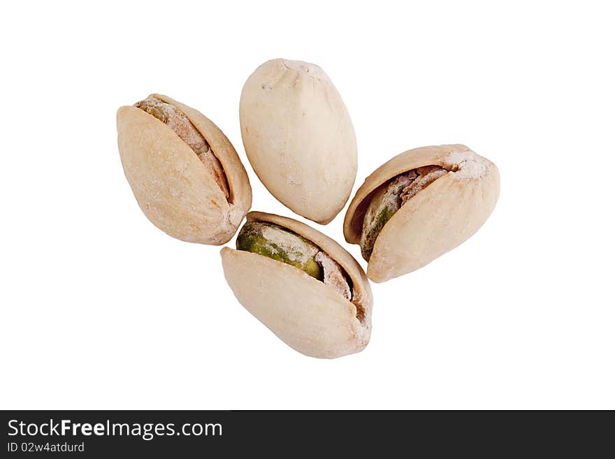 Four pistachios isolated on a white background.