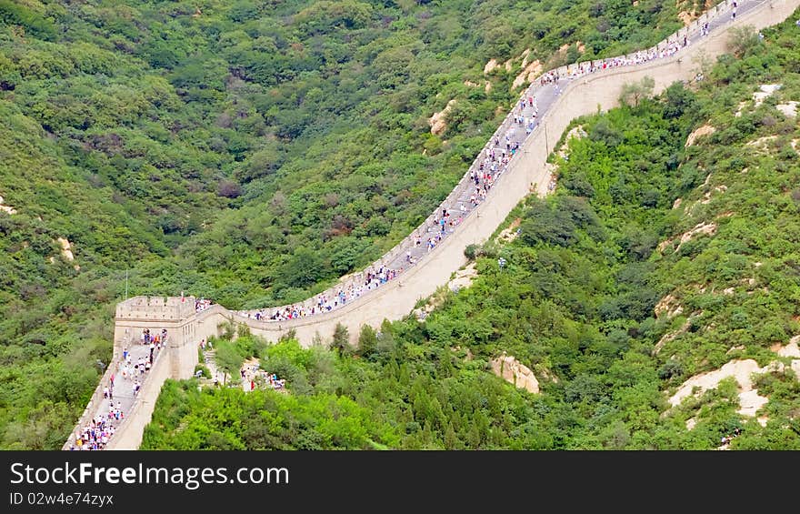 The Chinese great wall at Badaling in the mountains in the north of the capital Beijing with a lot of tourists. The Chinese great wall at Badaling in the mountains in the north of the capital Beijing with a lot of tourists