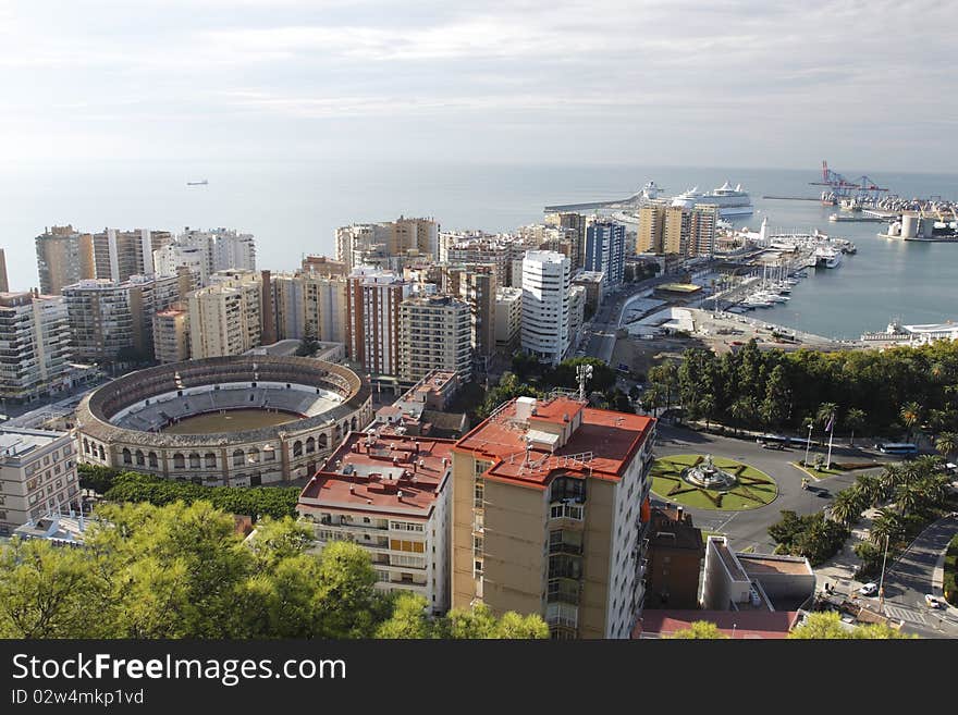 Málaga and its port as seen from Gibralfaro mountain. Málaga is a city and a municipality in the Autonomous Community of Andalusia, Spain. Málaga and its port as seen from Gibralfaro mountain. Málaga is a city and a municipality in the Autonomous Community of Andalusia, Spain.