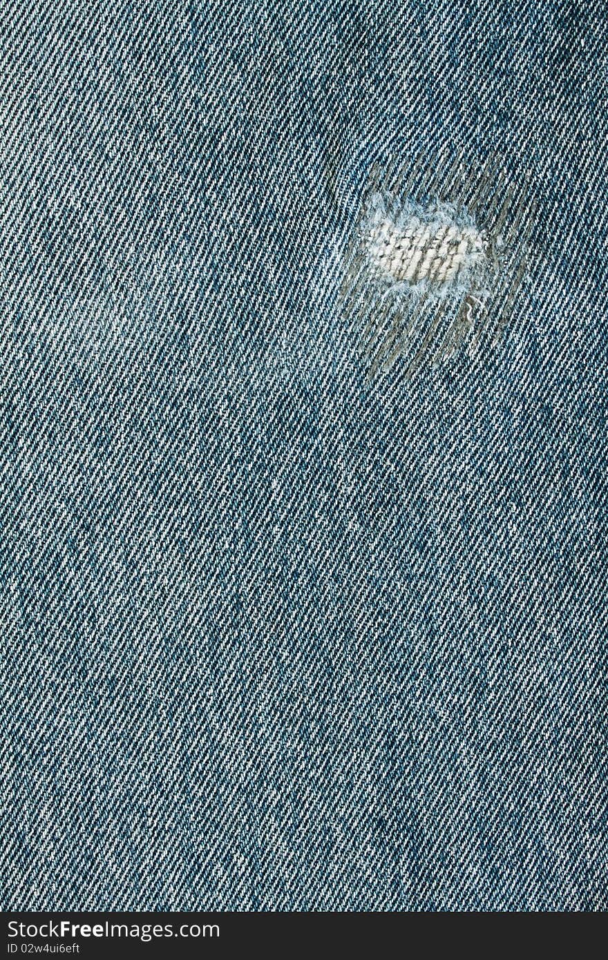 Torn old blue jeans background,dirty pants. Torn old blue jeans background,dirty pants