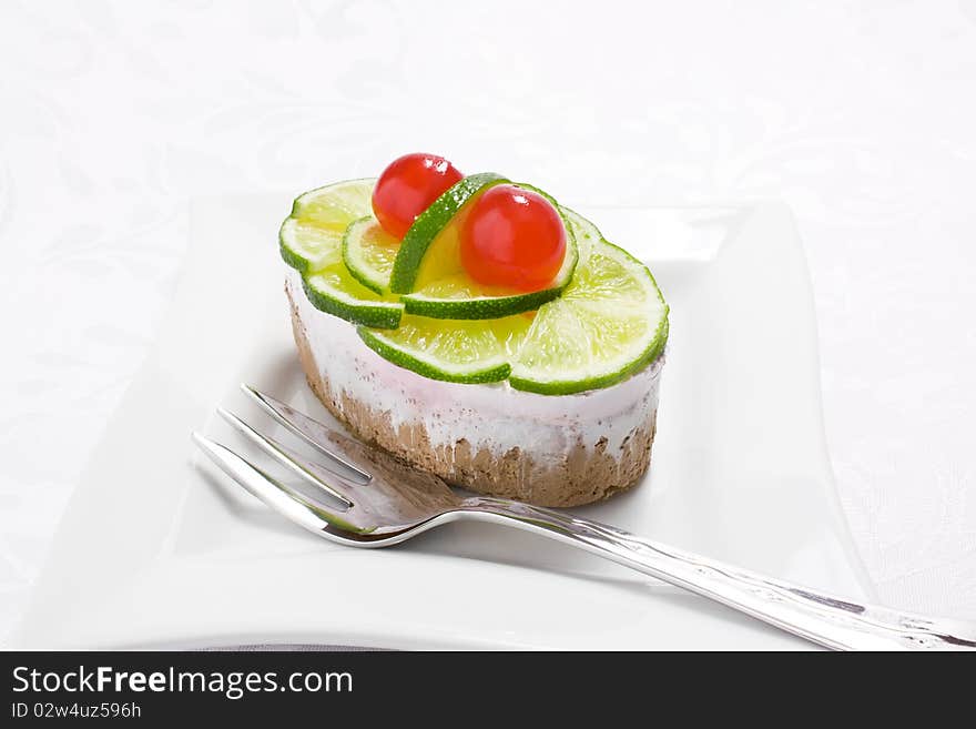 Sponge cake with lime and cherry