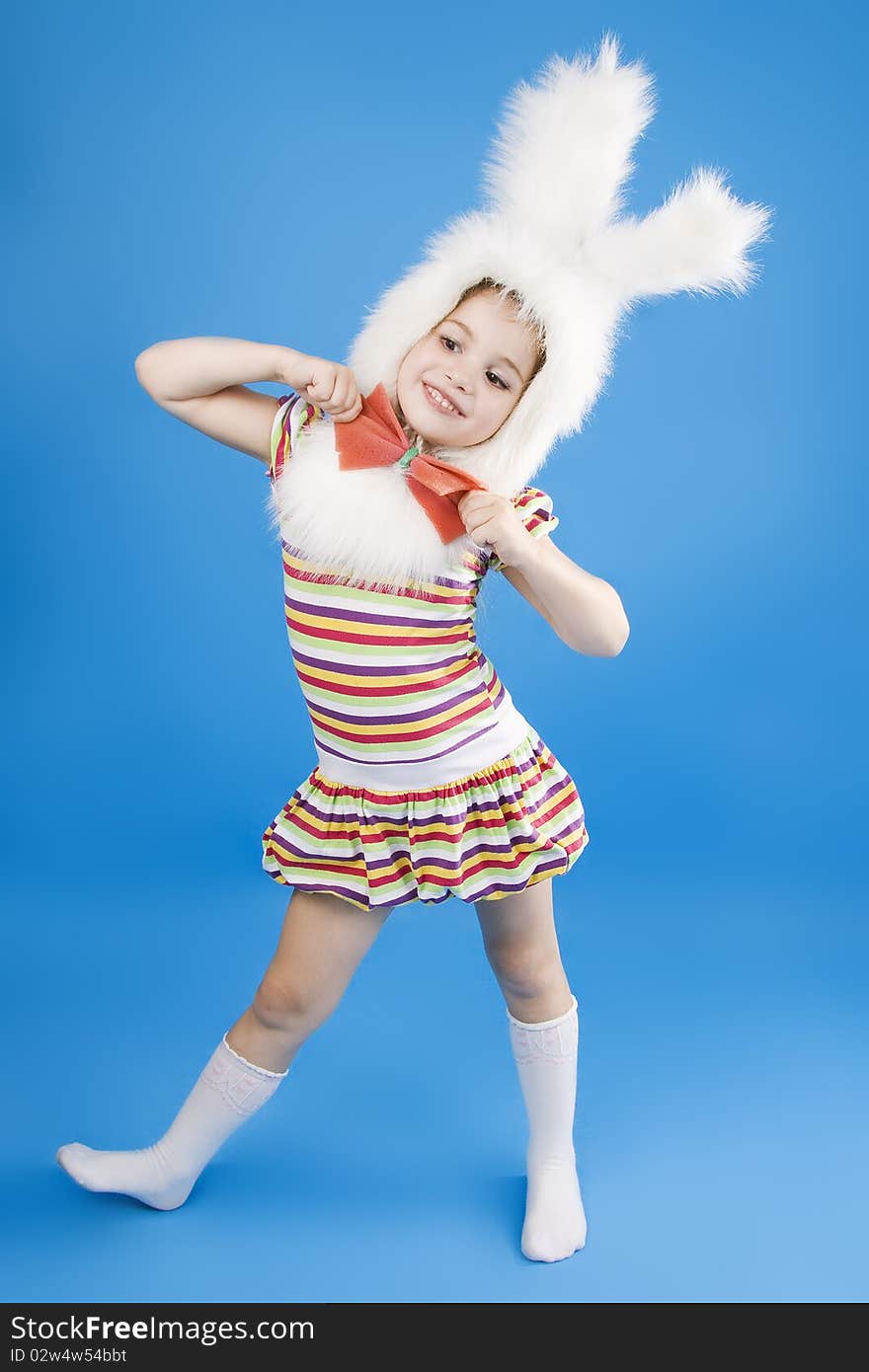 Сhild in a white downy bunny costume.