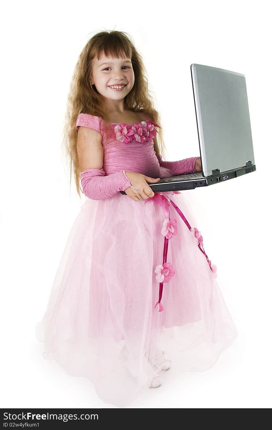 Little girl the princess plays with the notebook. White background. Little girl the princess plays with the notebook. White background