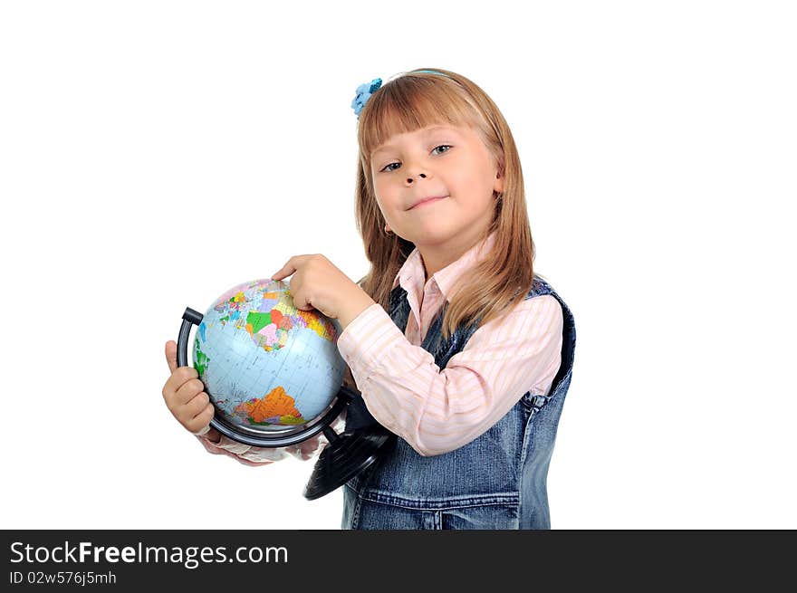 The little girl studies the globe on white