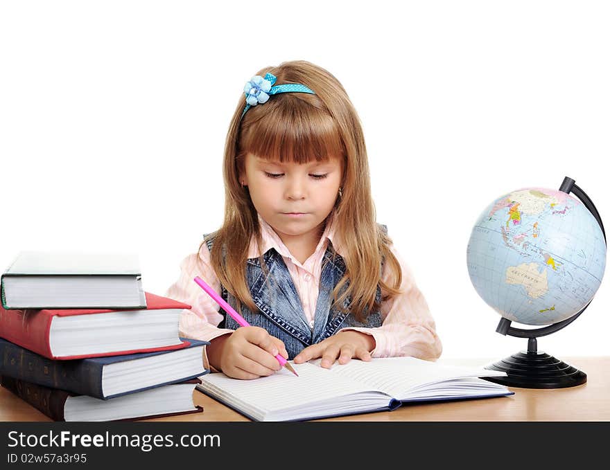 Girl Sits At A Table And Writes