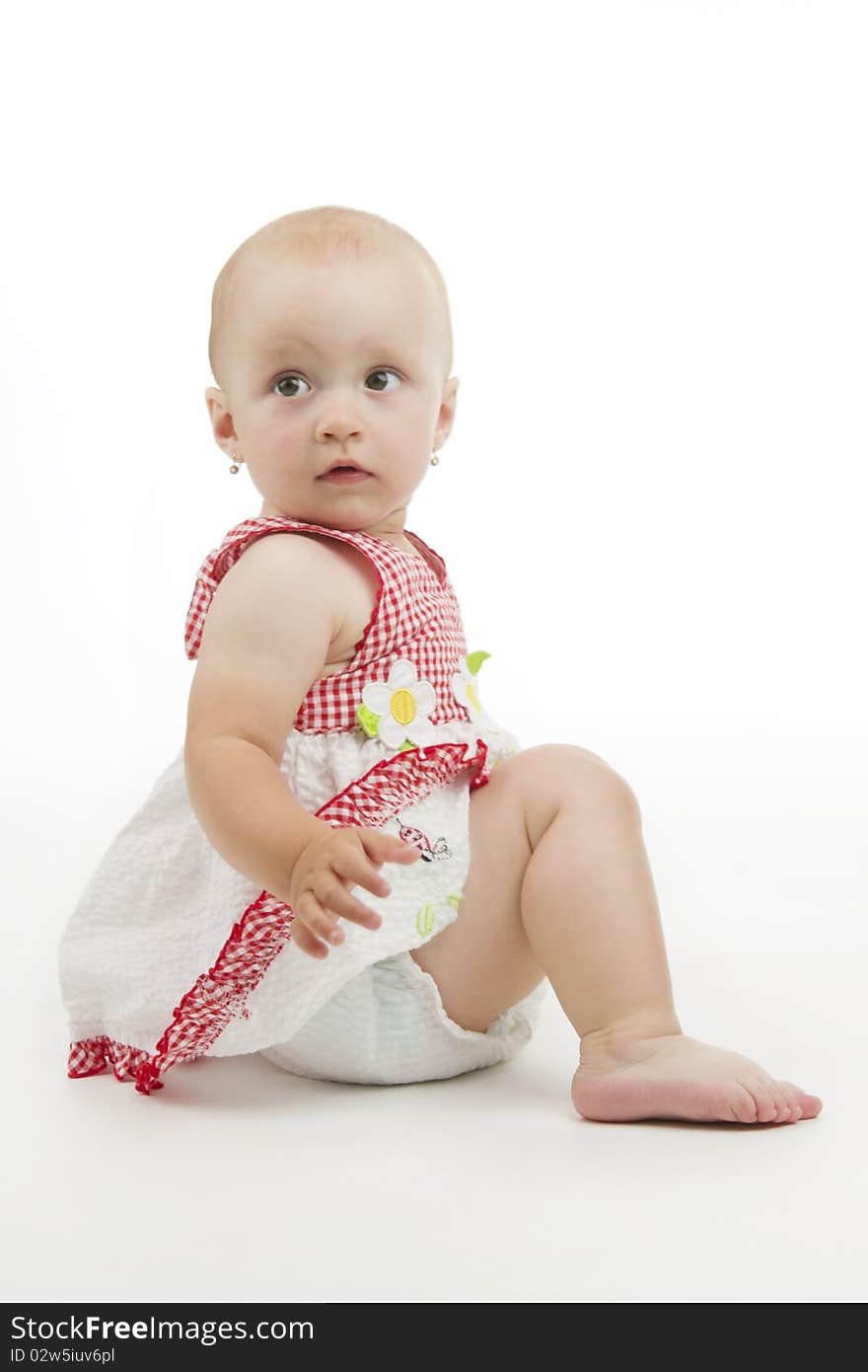 Beautiful little girl wind sideward to camera fixed view, of white background. Beautiful little girl wind sideward to camera fixed view, of white background.