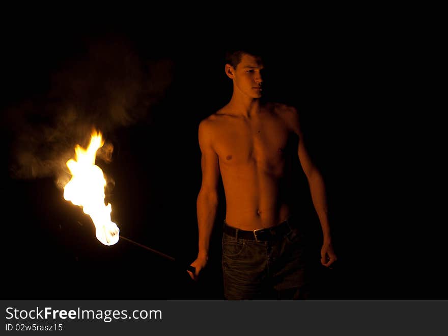 Fire-eater performance on a street