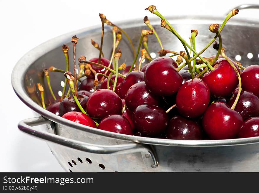 Red cherries on the colander