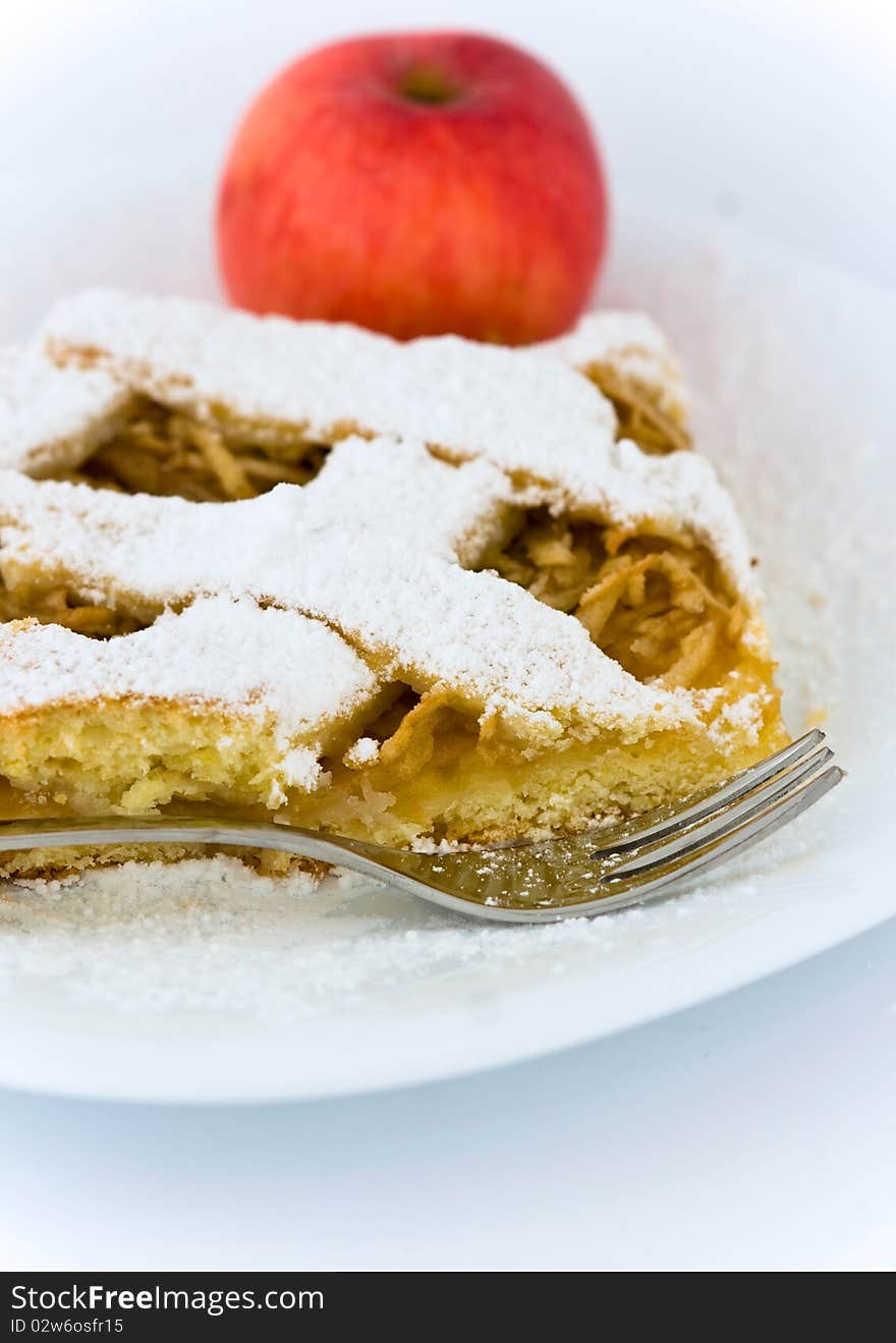 Slice of apple pie on plate.