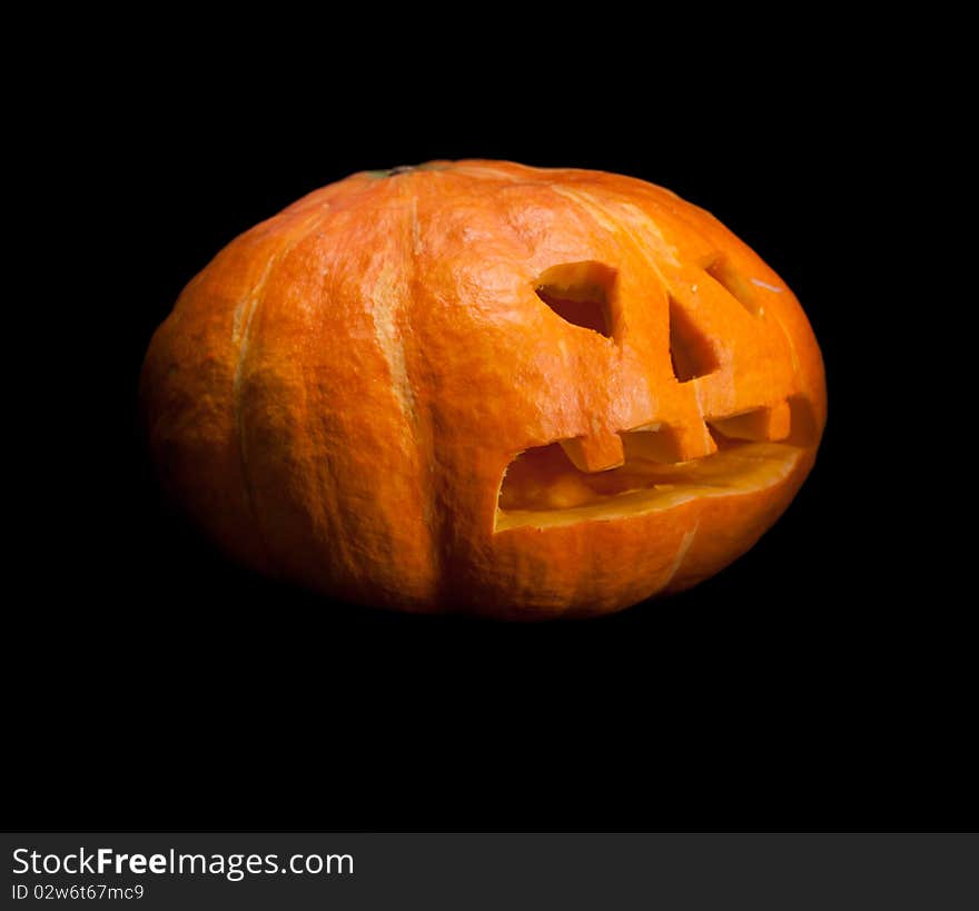 Jack-o-lantern against a dark. Black background