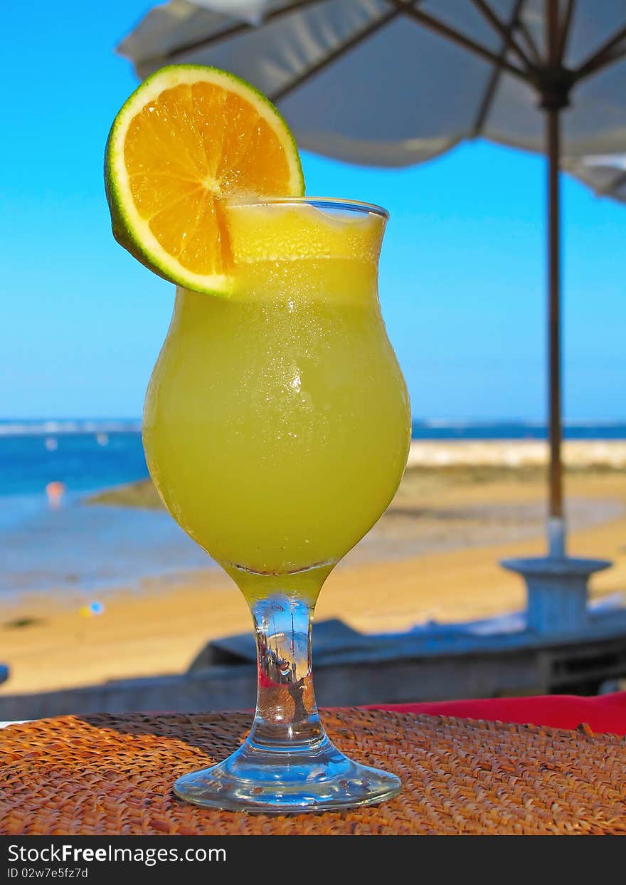 Fresh fruit cocktail on a tropical island beach