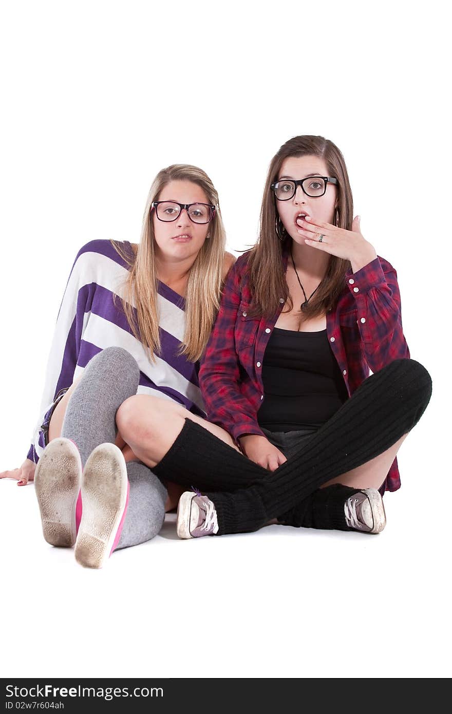 Young stylish teenagers chatting - isolated over white background. Young stylish teenagers chatting - isolated over white background.