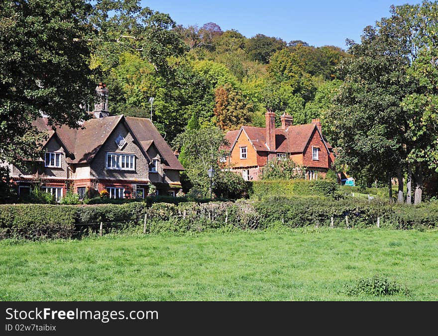 An English Rural Landscape with Cottages in the trees. An English Rural Landscape with Cottages in the trees