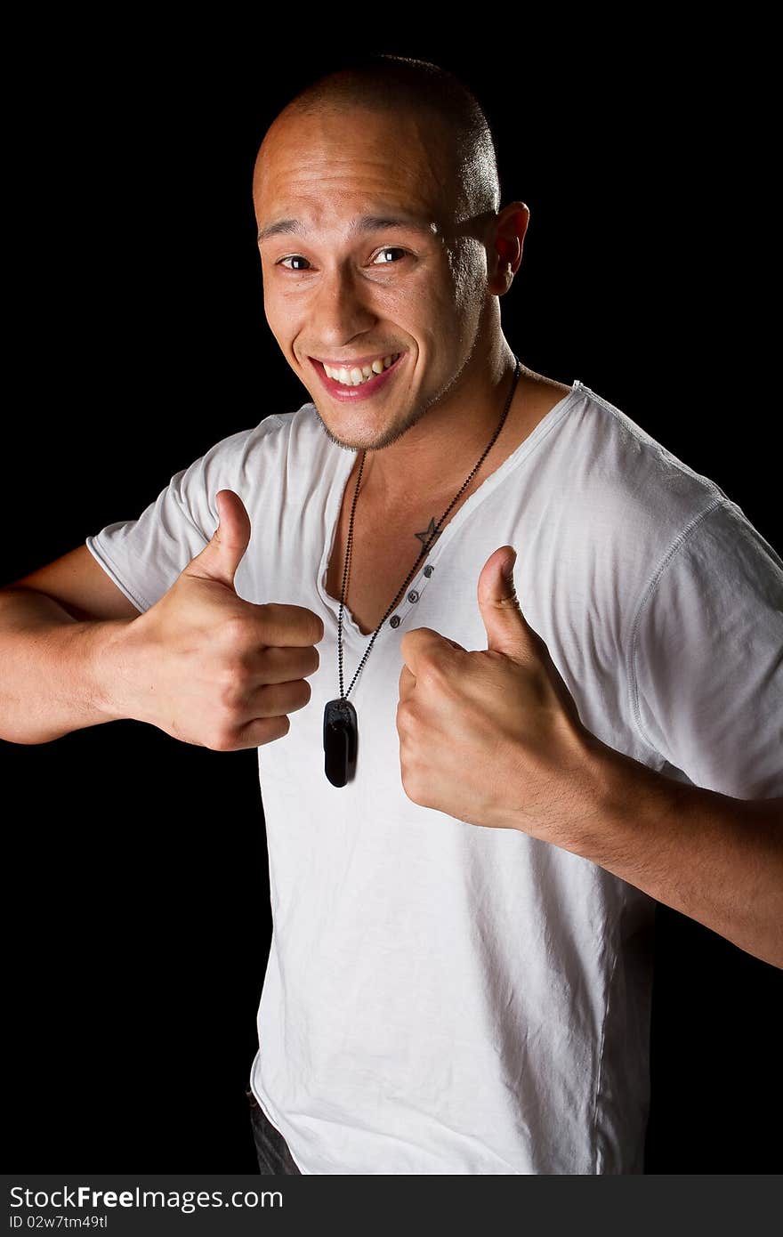 Young male filipino model over a black background is gesturing with his hand. Young male filipino model over a black background is gesturing with his hand.